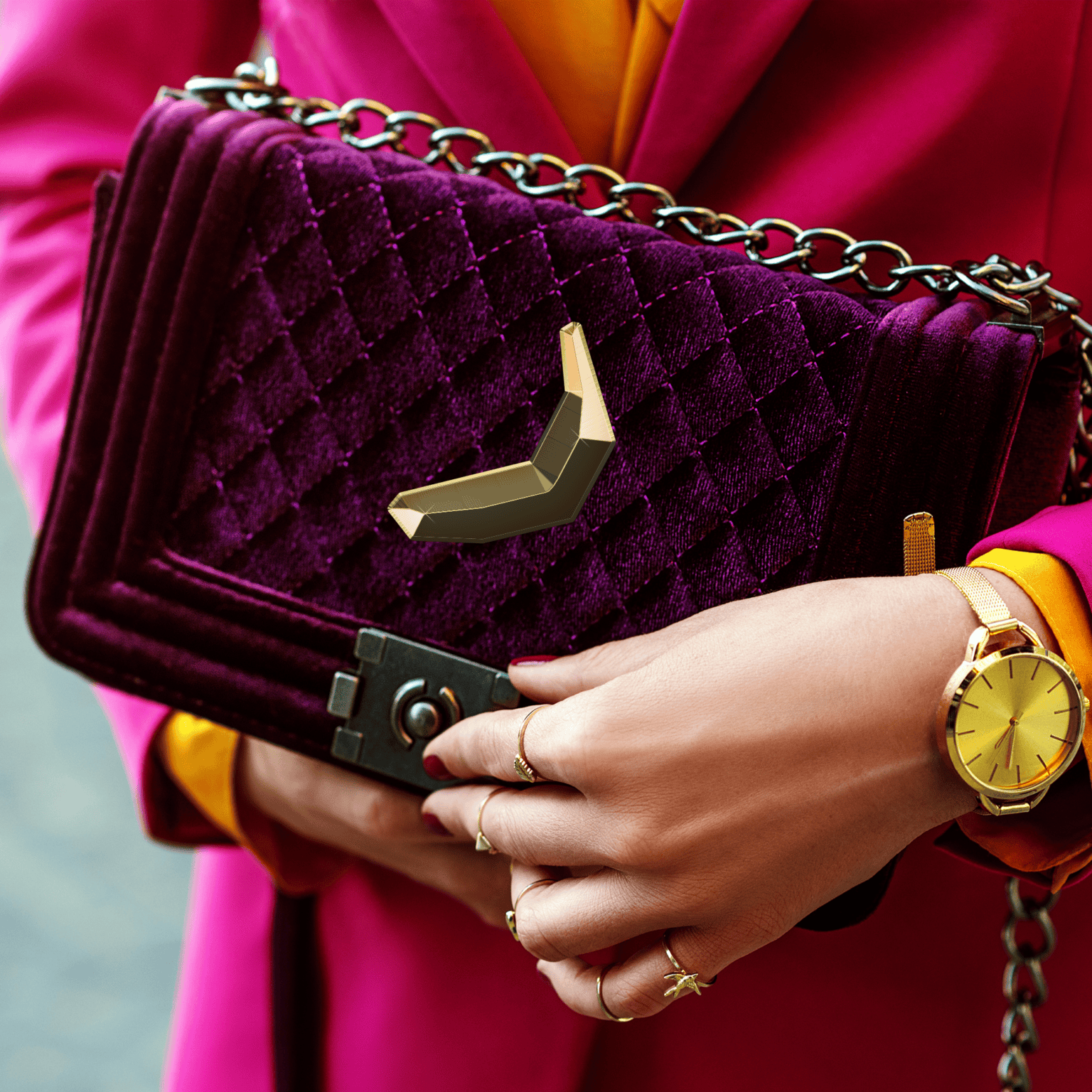Woman with purple designer handbag featuring gold Equifruit Fairtrade banana charm symbolizing premium brand